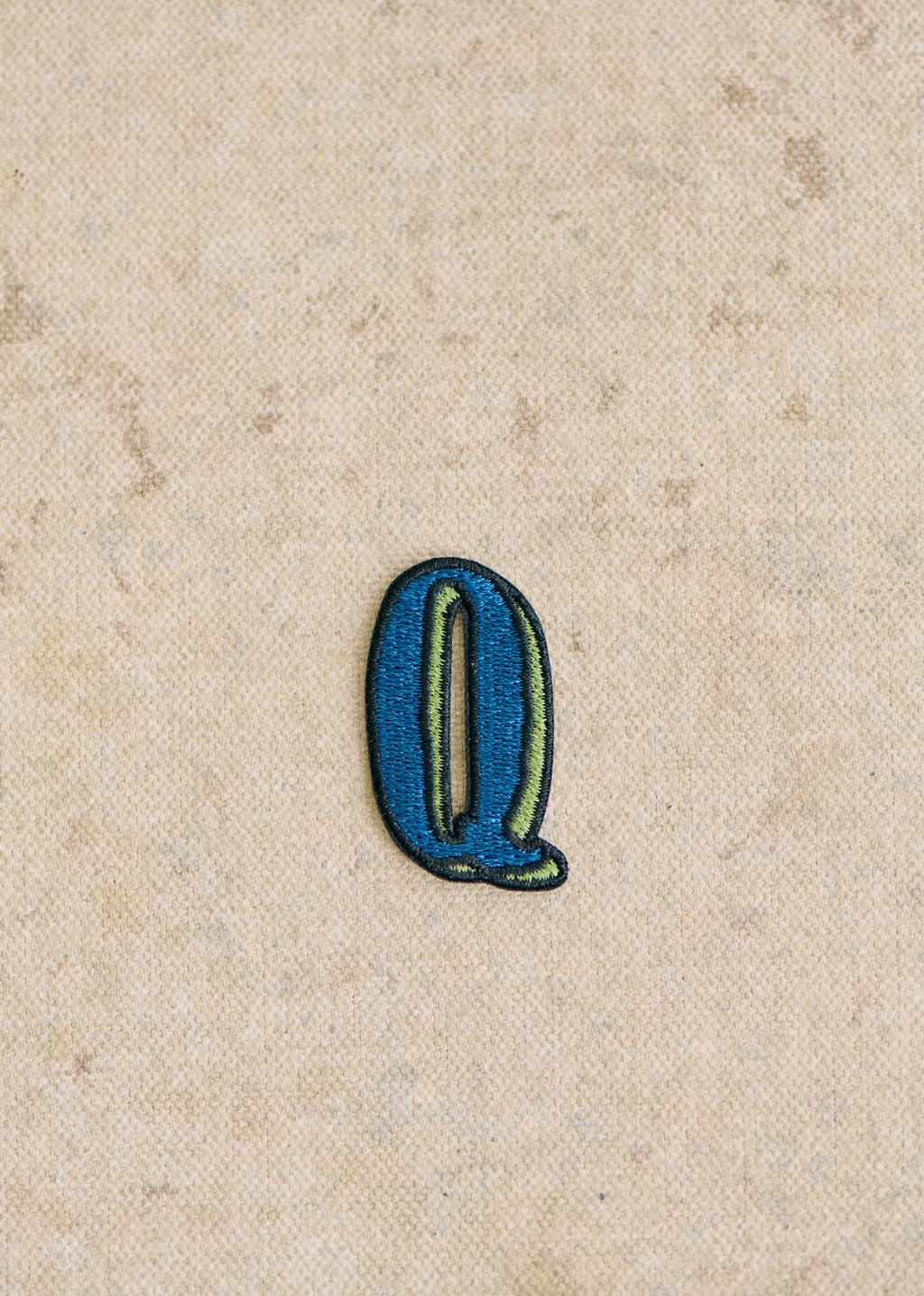 Ecusson vert / bleu - Lettre Q - Bleu