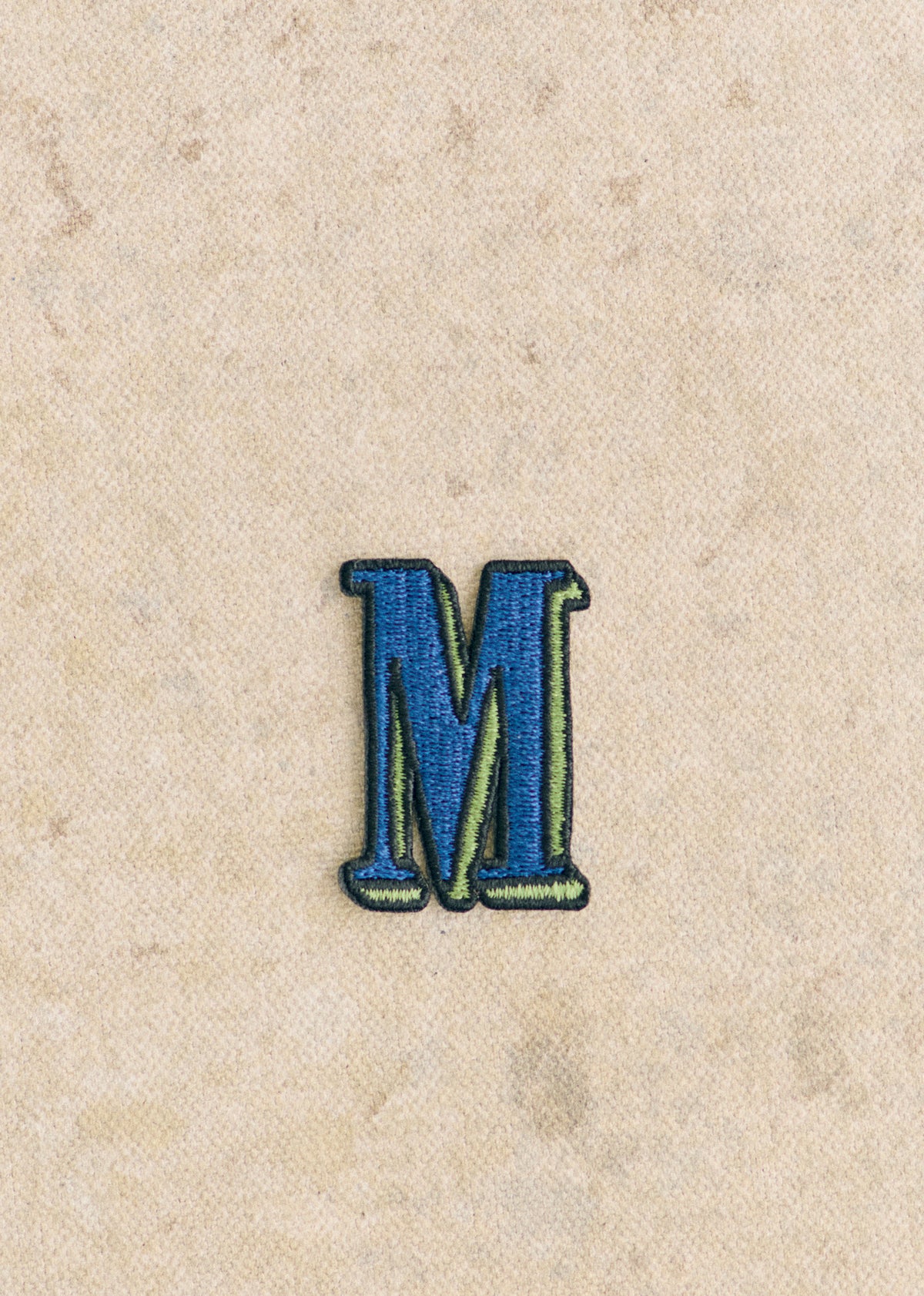 Ecusson vert / bleu - Lettre M - Bleu