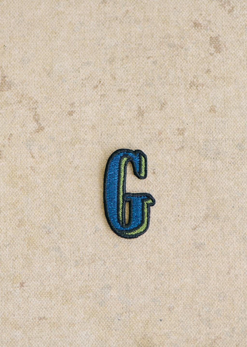 Ecusson vert / bleu - Lettre G - Bleu