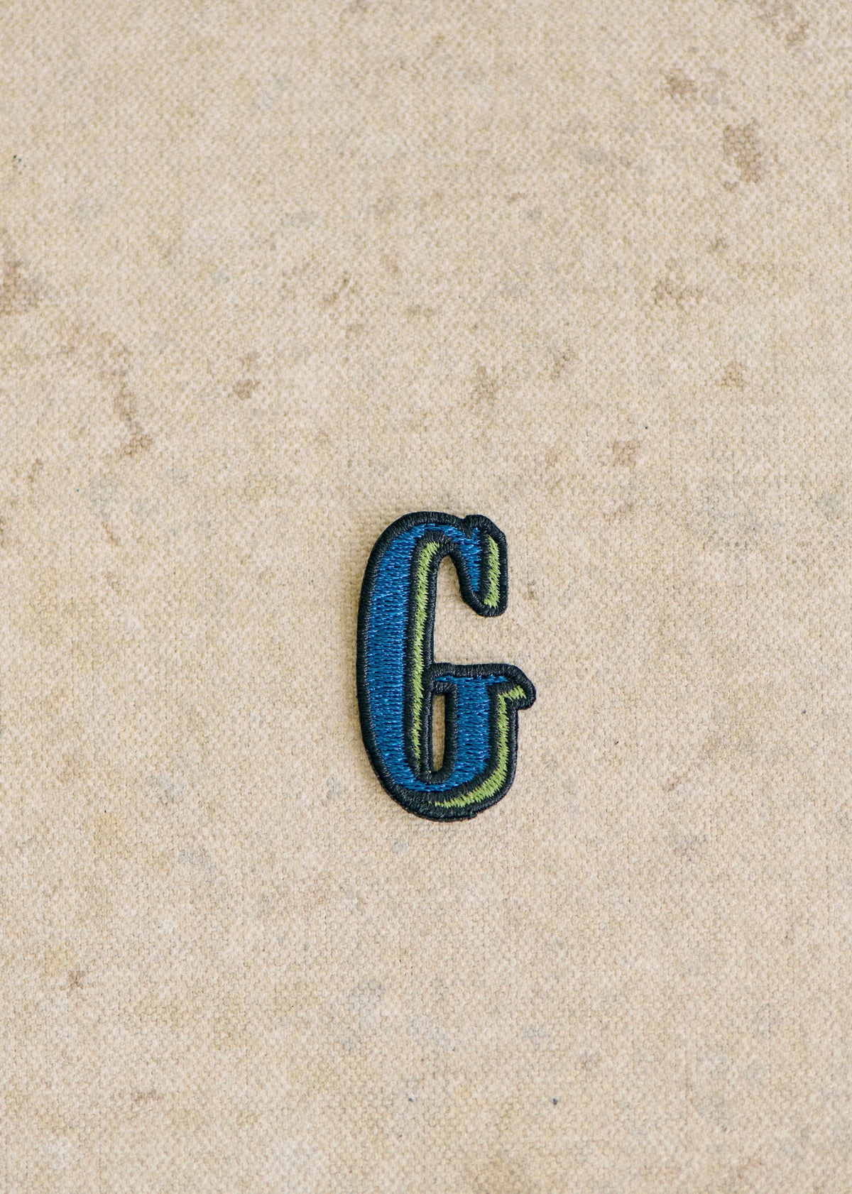 Ecusson vert / bleu - Lettre G - Bleu